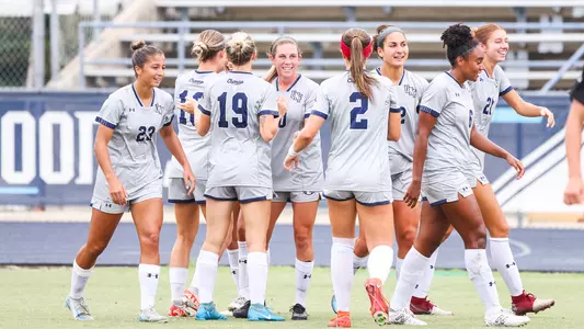Women's soccer celebrating a goal against Lipscomb