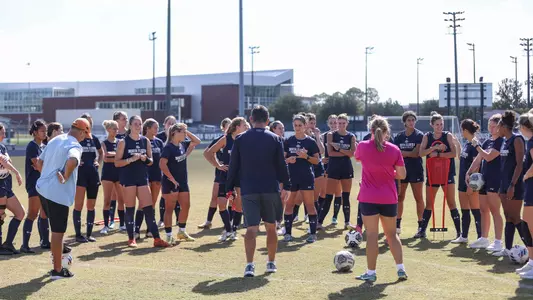 Women's soccer huddled up at practice