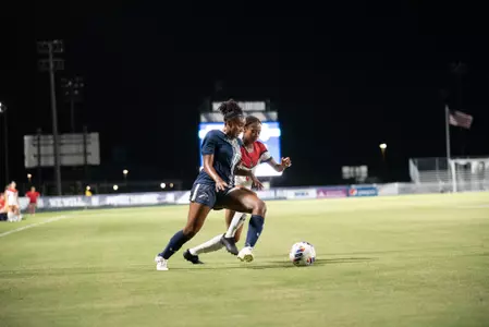 Allyna Thurston taking on the Austin Peay defender at Hodges Stadium