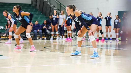 Amy Burkhardt waiting for a serve