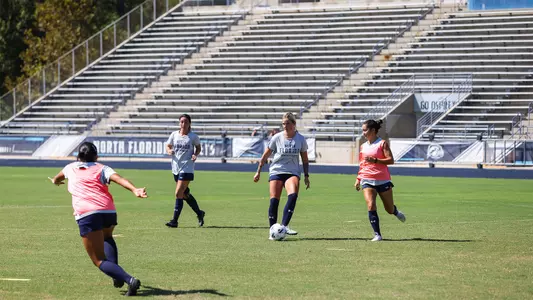 Bella Pontieri passing the ball at women's soccer practice