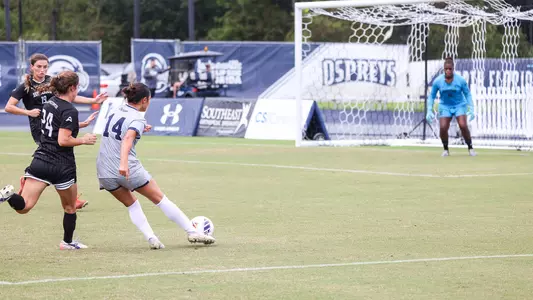 Paige McSwigan shooting the ball against Lipscomb