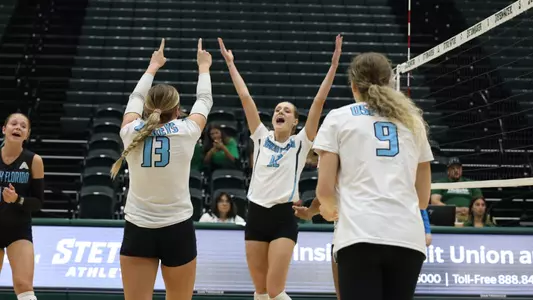 Amy Burkhardt celebrating a point against Stetson