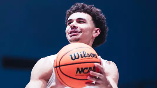 Kamrin Oriol going up for a jump shot at shoot around