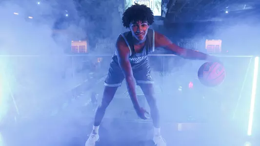 Josh Harris dribbling the ball on balcony