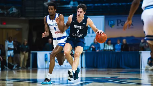 Nate Lliteras driving with the ball