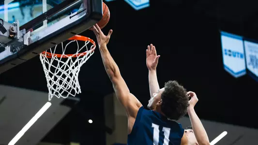 Kamrin Oriol driving layup at Asheville