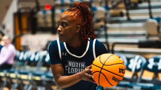 Jazmine Spencer swinging ball out at practice