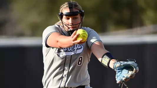 Allison Benning pitching on opening game