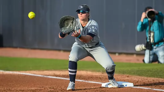 Logan Jackson catching ball thrown to first