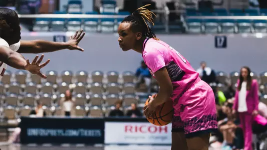 Jayla Adams holding ball at the top of the key