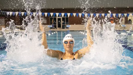 Amelia Hildebrand splashing water at the UNF Competition Pool Complex