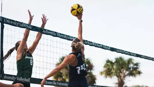 Madison Espy going up for the kill against Jacksonville
