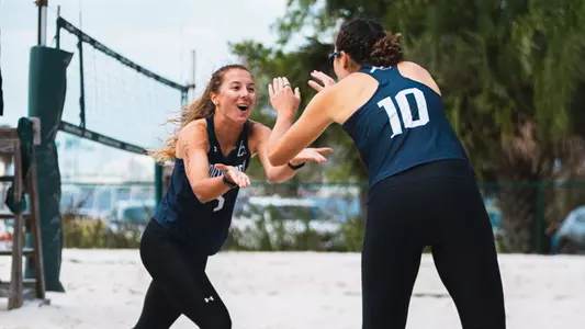 Beach volleyball celebration picture at JU