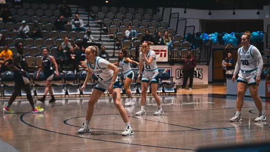 Team on defense against Queens