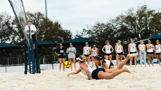 Mackenzie Murphy going in for the dig at the Coop Beach Volleyball Complex