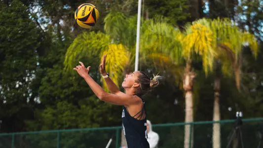 Madison Espy serving the ball at Jacksonville University