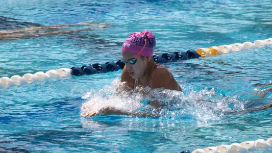 Victoria Torres swimming breaststroke at the UNF Competition Pool Complex
