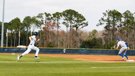 Cade Reich running to first