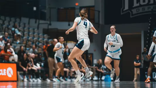 Sarah Taub running down the court at UNF Arena