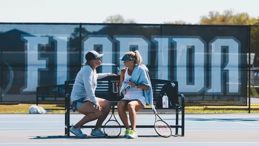 Kendall Nash talking on the bench with coach