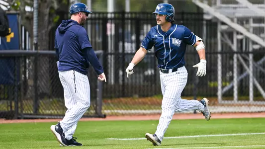 Jakob Runnels rounding the bases
