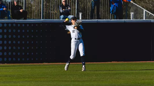 Madisyn Federico throws ball back to infield