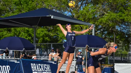 Presley Murray serving the ball at the Cooper Beach Volleyball Complex