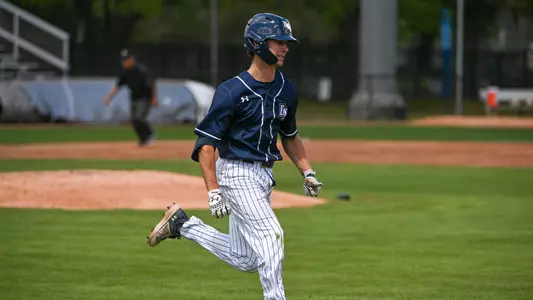 Jabin Bates runs to first base
