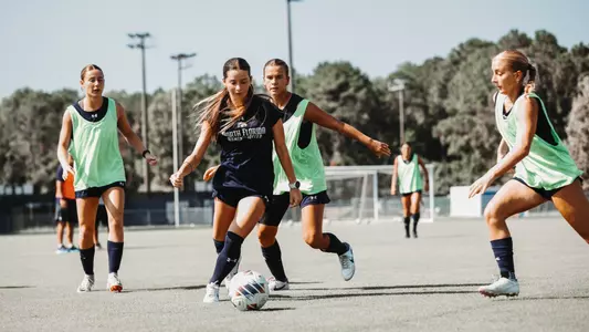 Avery Raimondo dribbling at UNF women's soccer practice