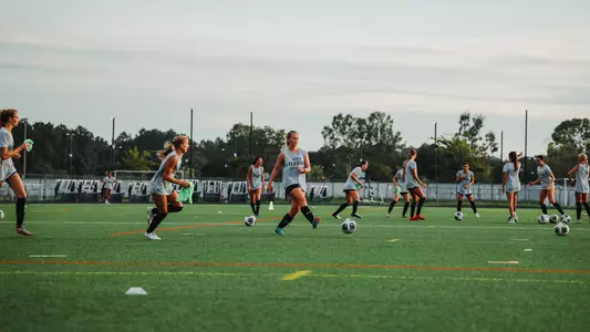 Women's Soccer practicing on the turf field adjacent to Hodges Stadium