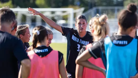 Ella Dudley talking to the women's soccer team against Kennesaw State