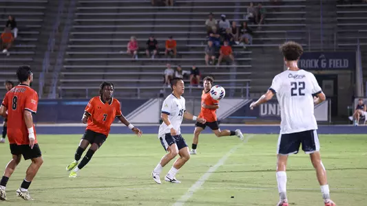 Rentaro Miyakawa dribbling against Mercer
