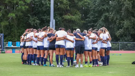 Women's soccer huddling up before their match at Georgia Southern