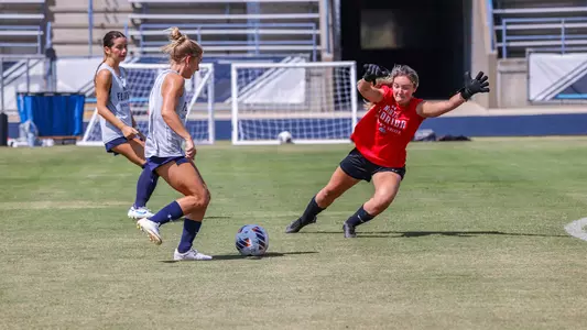 Allison Souers shooting on goal at women's soccer practice