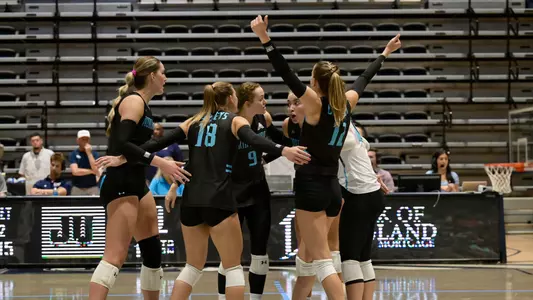 UNF volleyball team huddle vs. JU
