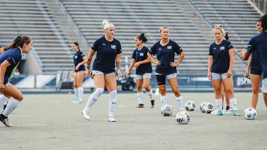 Women's Soccer warming up for their match against Mercer