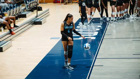 Janelly Ceopa dribbling before serve