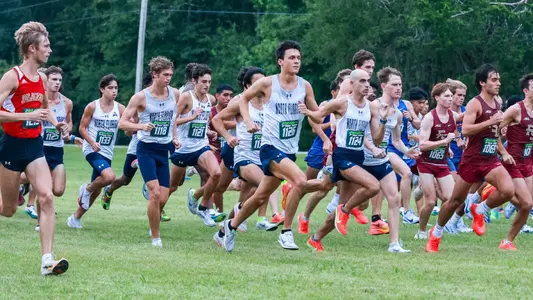 Men's cross country team running 2025