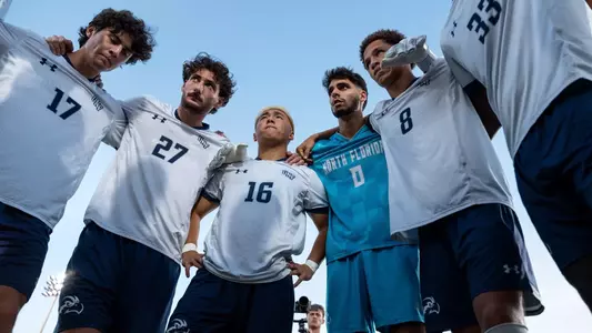 Team huddle prior to a match with midfielder Jacob Harris, defender Bryce Warhaft, midfielder Rentaro Miyakawa, goalkeeper Iu Pentinat and defender Jaylen Yearwood