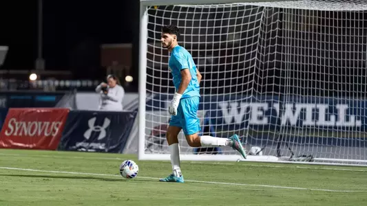 Goalkeeper Iu Pentinat controls the ball at his feet, ready to clear it to a teammate