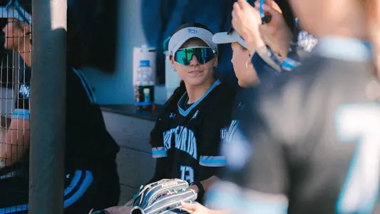 Logan Turner in the dugout softball