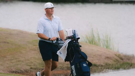 Brett Schell with golf cart