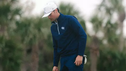 Filippo Serra lining up a putt