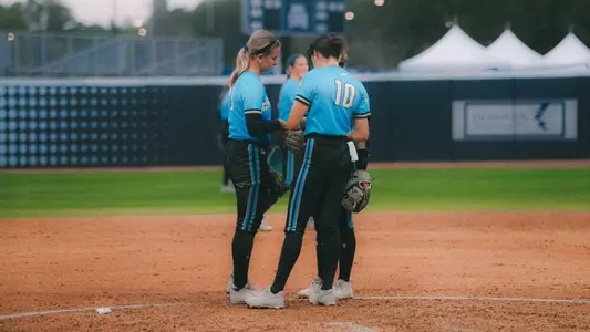 Macie Hunolt in the circle with team