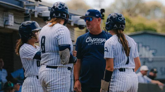 Softball meeting at home plate