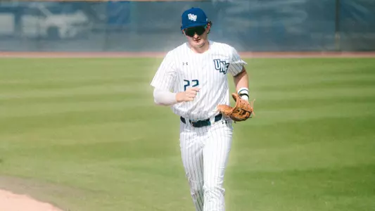 Drew Leinenbach running to dugout