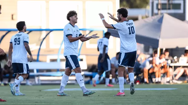 Emir Trto and Anton Khelil celebrate after a goal