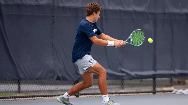 Joao Portugal hitting a tennis ball