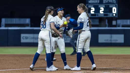 Cam Ponich with fielders in the circle